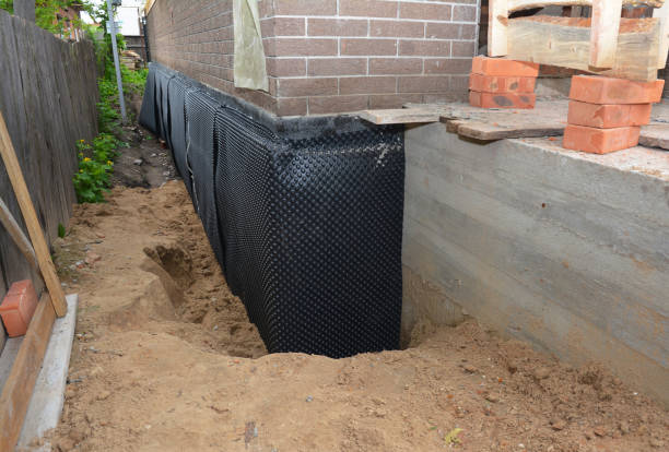 Happy homeowners after waterproofing job in Hammond